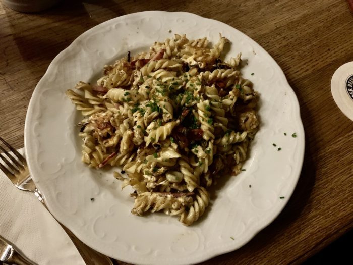 Pasta sautéed with bacon and herbs.